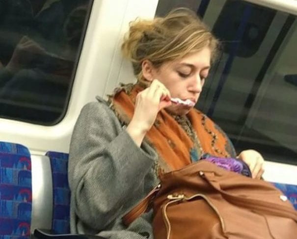 Rushed Commuter Brushes Her Teeth On The Way To Work